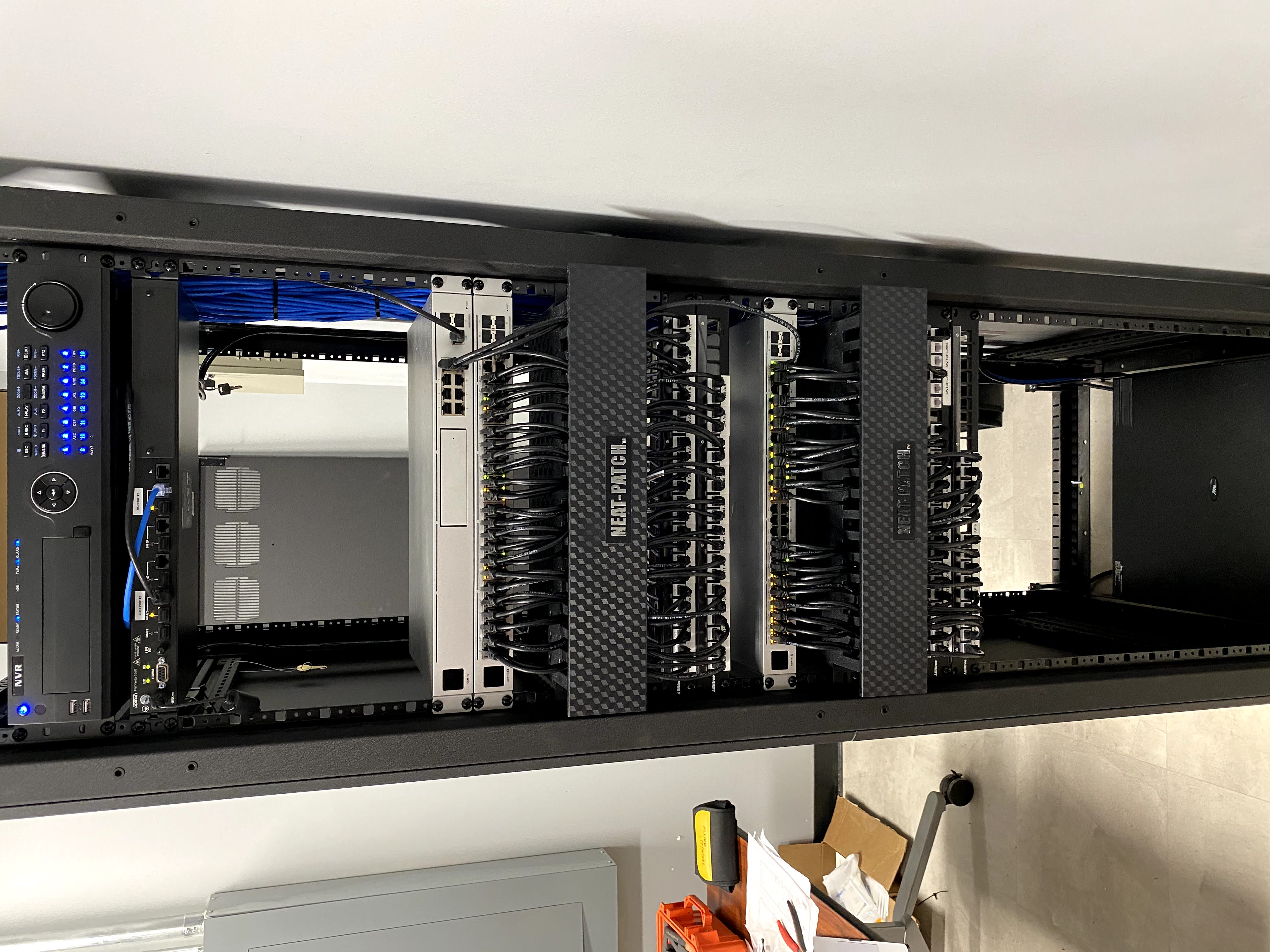 Clean network rack with Ubiquiti switches and cable management